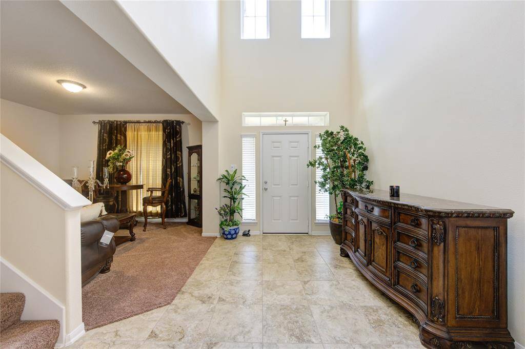 Neutral pain and two-story entry greet your guests as they enter.