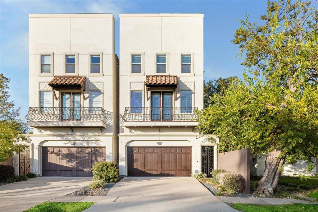 Modern home features a three-story design with a stylish exterior, balcony, and a spacious two-car garage. The exterior is complemented by well-maintained landscaping and a private driveway.