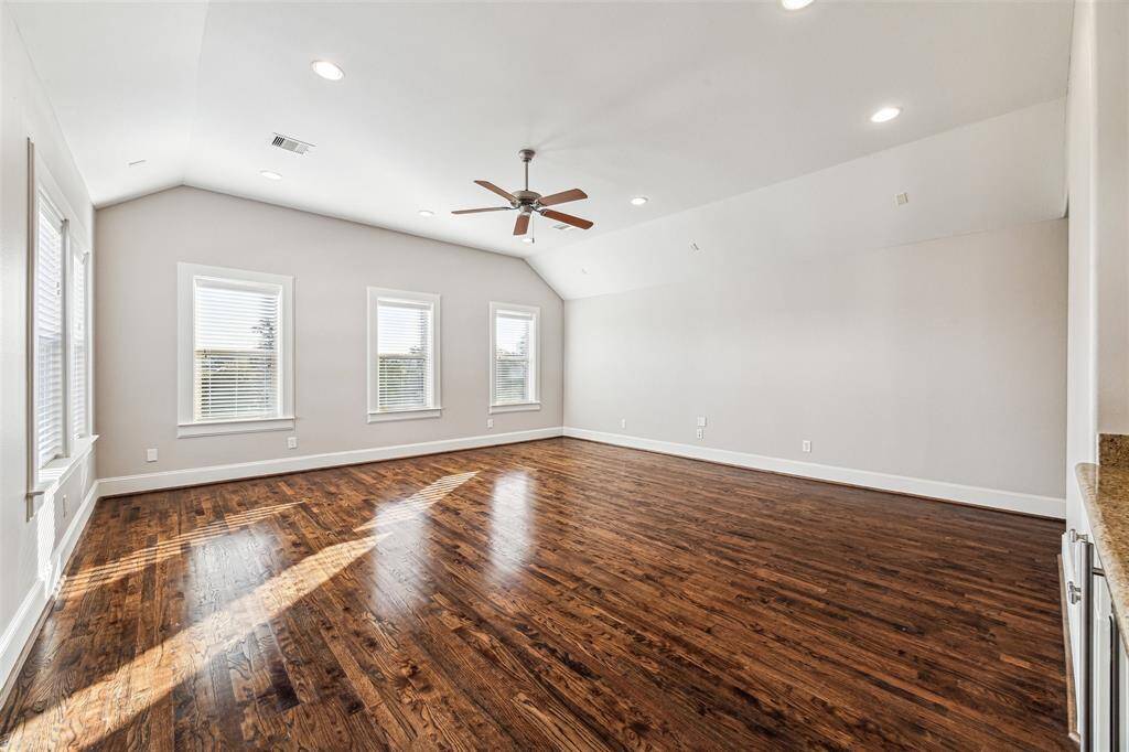 Expansive third-floor room with a full bath, perfect for a game room or flexible use!
