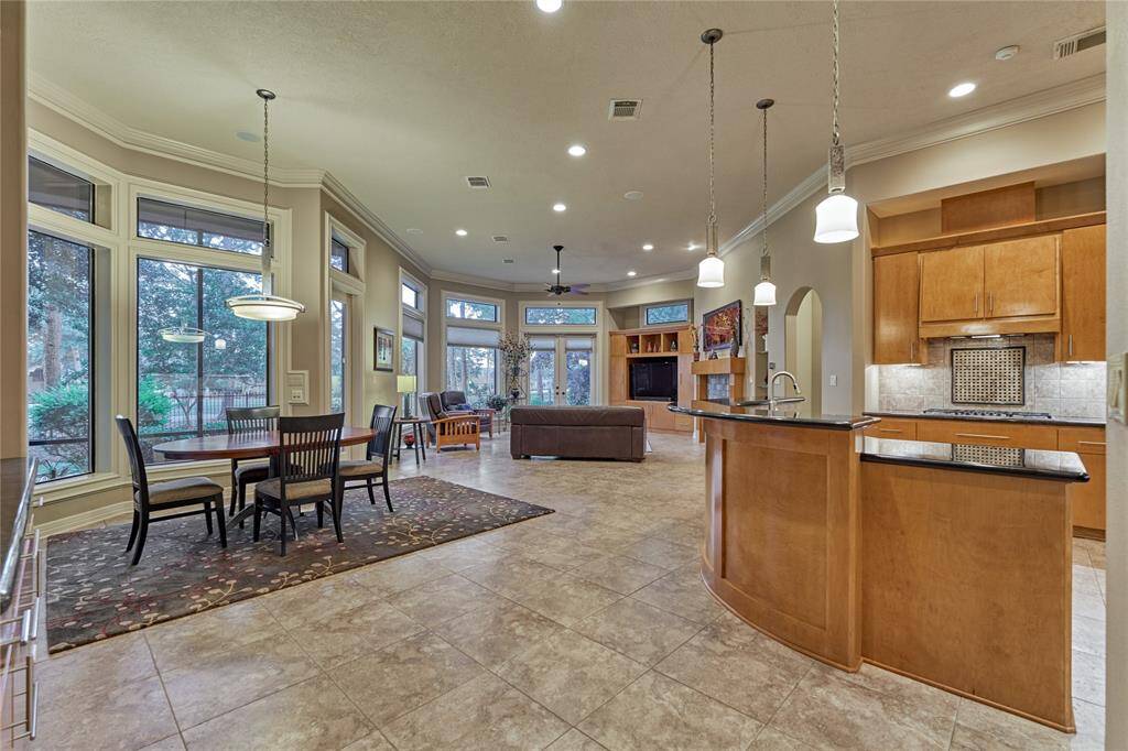 Experience breathtaking golf course views through expansive windows in this open floor plan.
