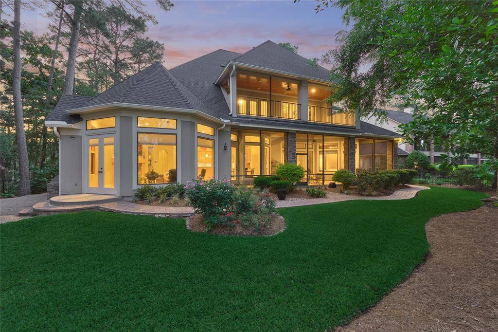 Rear elevation showing the large picture windows that extends all along the back of the home.