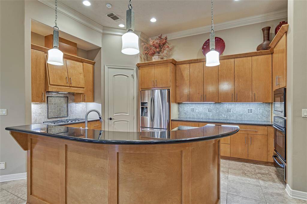 The breakfast bar accommodates extra seating and serving space for entertaining.