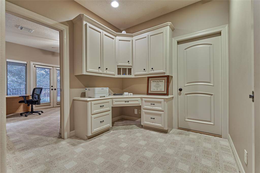 Convenient built-in office nook nestled between the two secondary bedrooms.