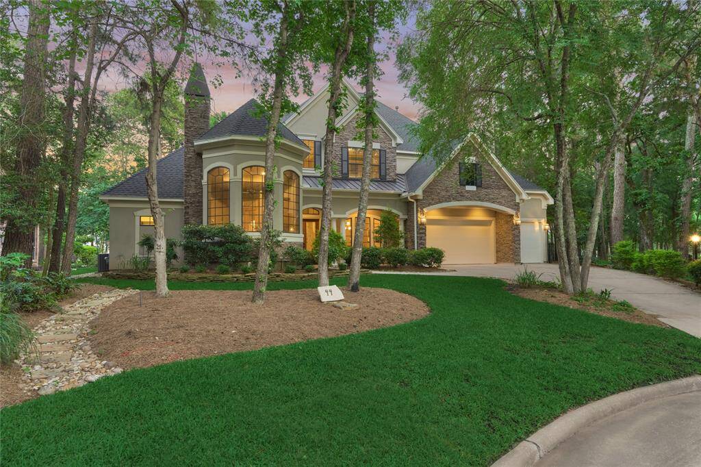 Impeccable landscaping and lush foliage can be found all around this magnificent estate.