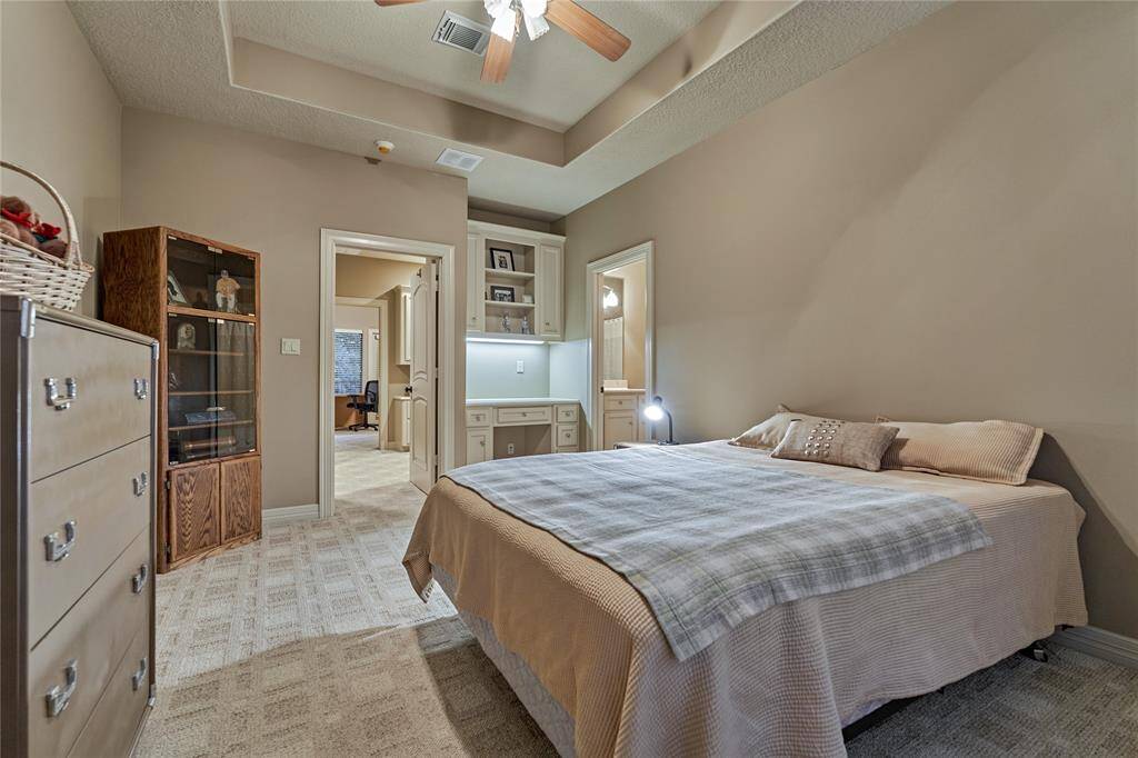Secondary bedroom #2 has a built-in desk area and overlooks the front yard.