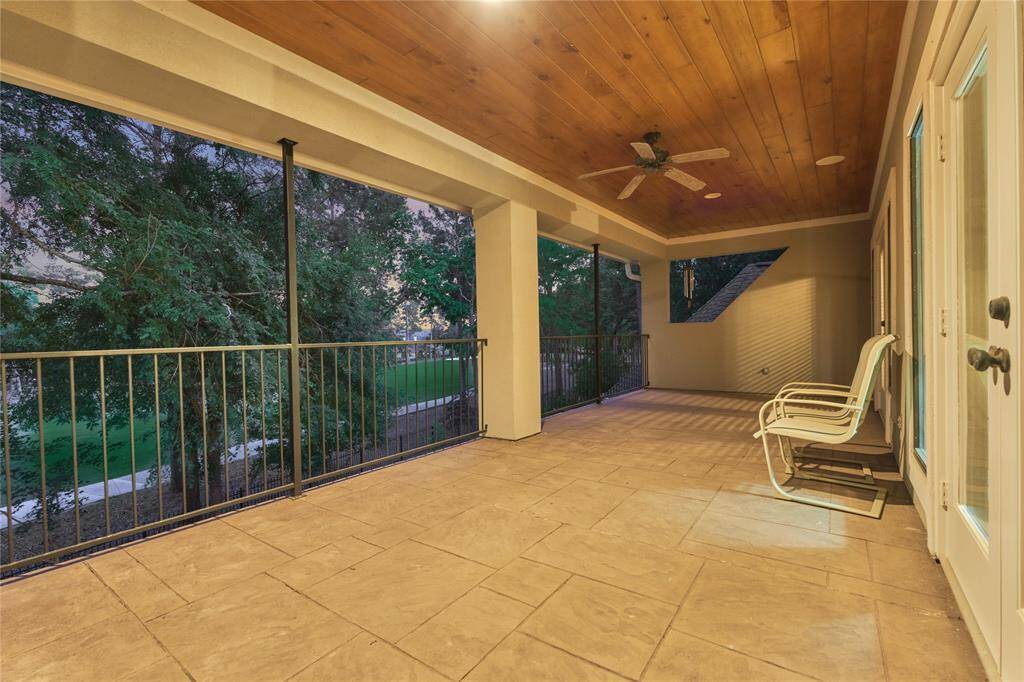 Relax on the serene, covered second-floor balcony, the ideal retreat for reading or savoring nature's beauty.