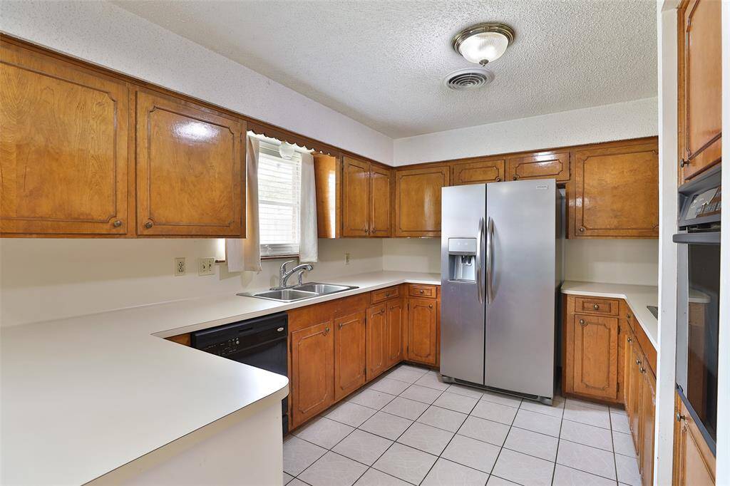 Lots of cabinets and counter space.  Refrigerator and diswasher stays!