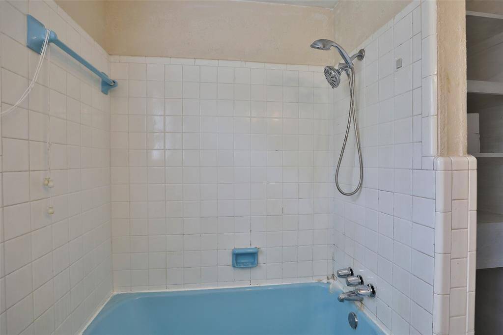 Downstairs bath features tub with shower!