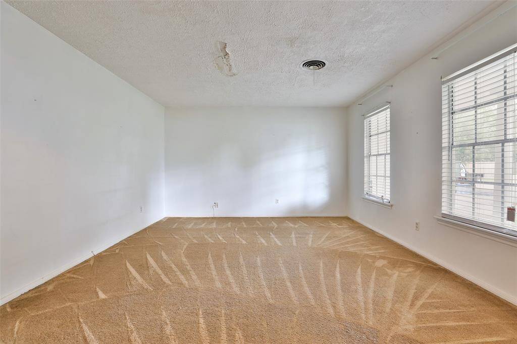 Formal living room. Great windows lets in natural light!
