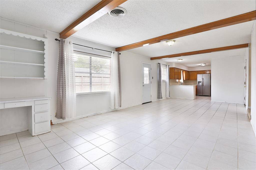 Your expansive den with the kitchen in the background.