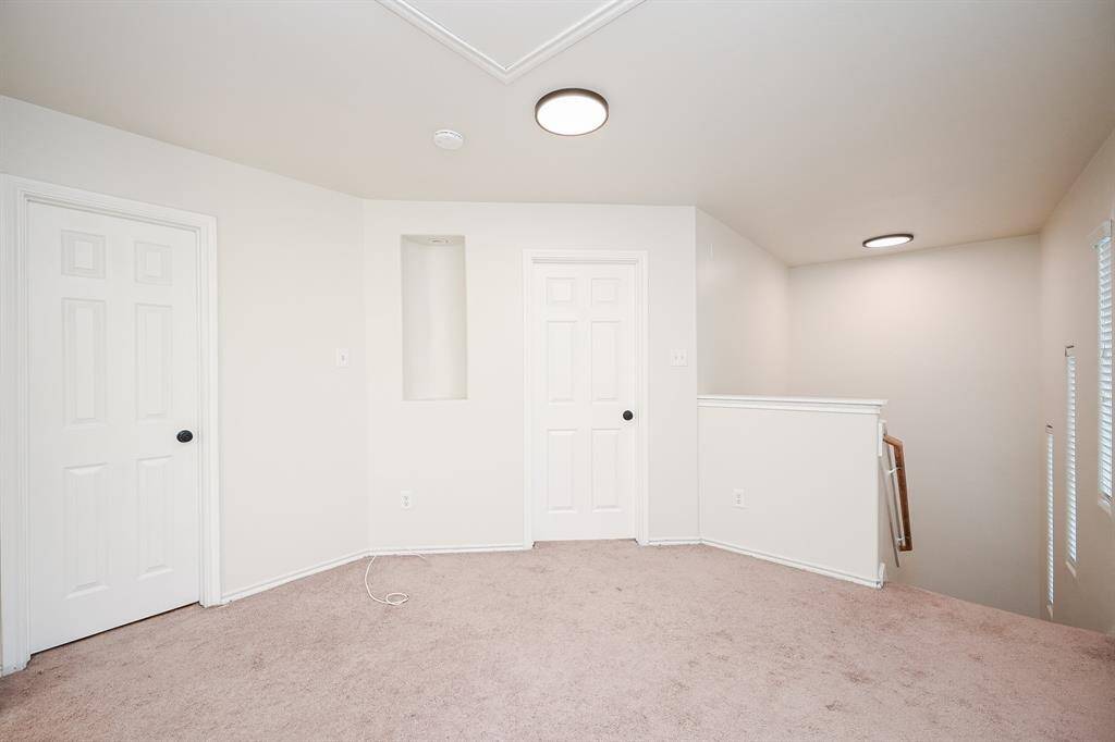 Upstairs landing offers a versatile space between bedrooms, perfect for a cozy reading nook or small office.