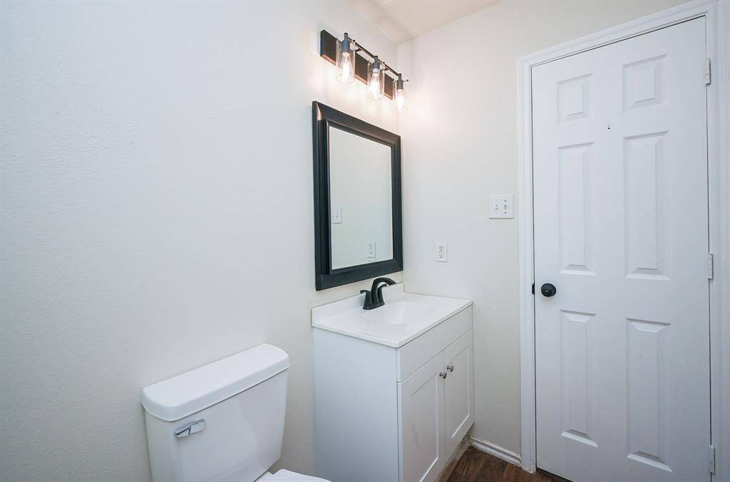 Upstairs features a stylish full bathroom, perfect for convenience and comfort.