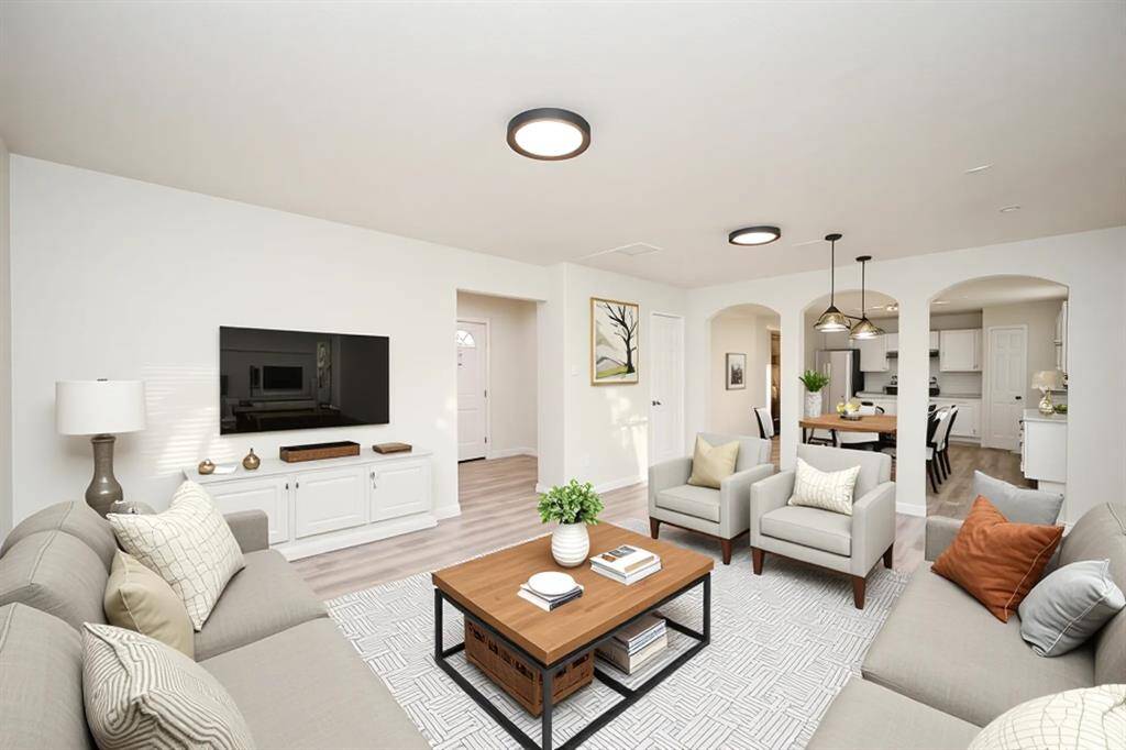 Experience the warmth and elegance of this virtually staged living room, perfectly designed to envision your future home.