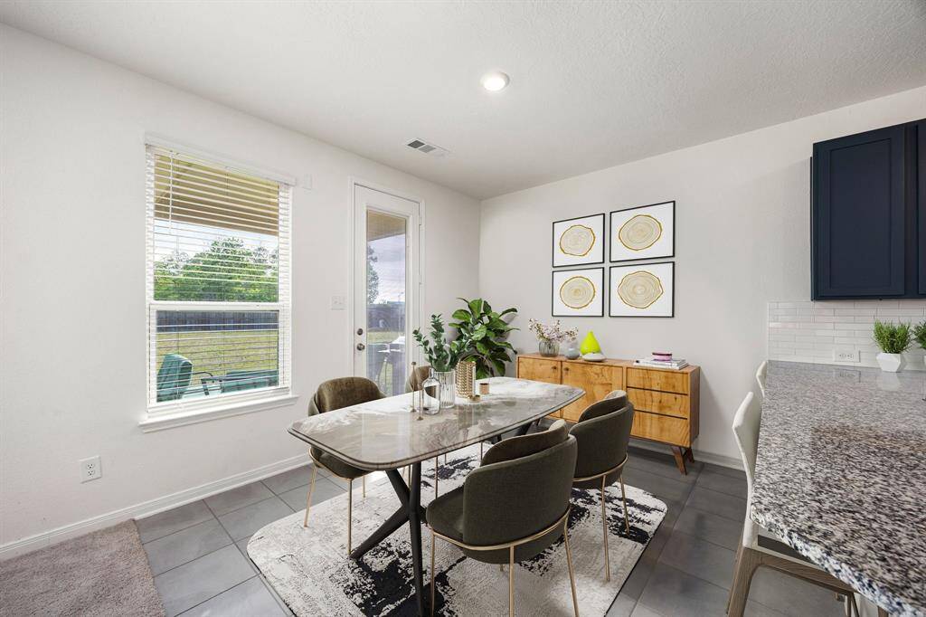 Start your day off right with a cup of coffee sitting with your family in the lovely breakfast area! Featuring large windows with blinds, neutral paint, tile flooring, recessed lighting and great access to your living room and kitchen. *virtual staging*