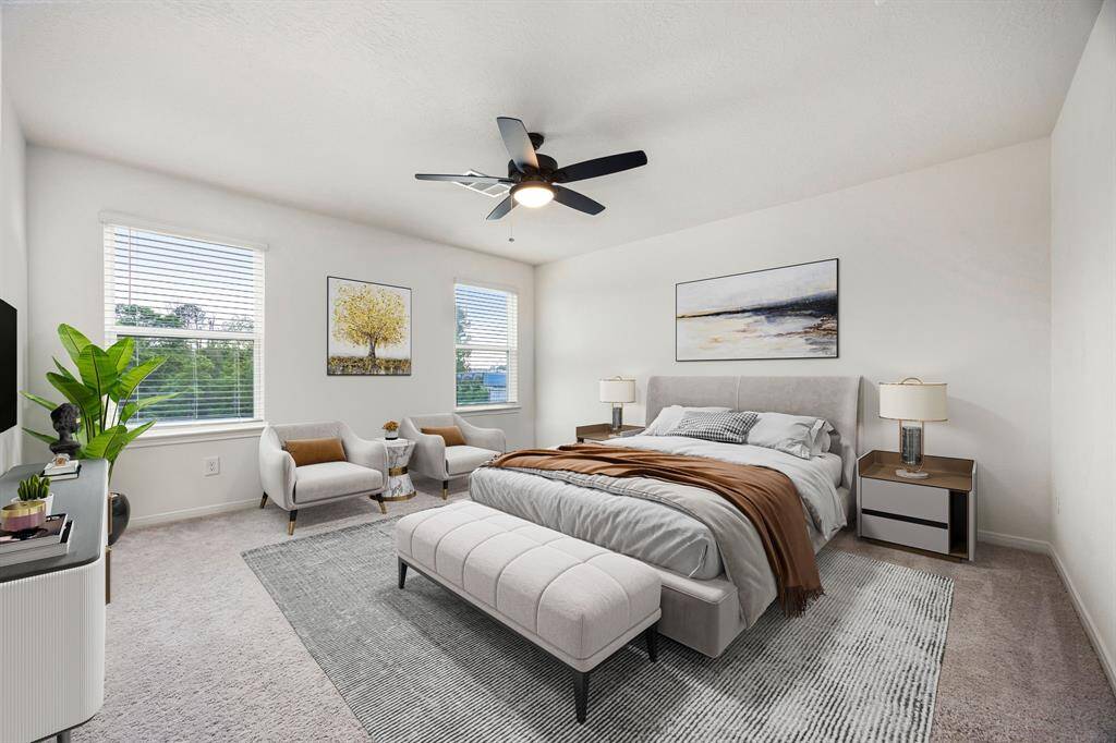 What a wonderful place to come home to! This stunning primary suite greets you with plush carpet floors, neutral paint, ceiling fan with lighting, large windows with blinds allowing in natural light brightening up this spacious primary bedroom with extra space for a seating area. *virtual staging*