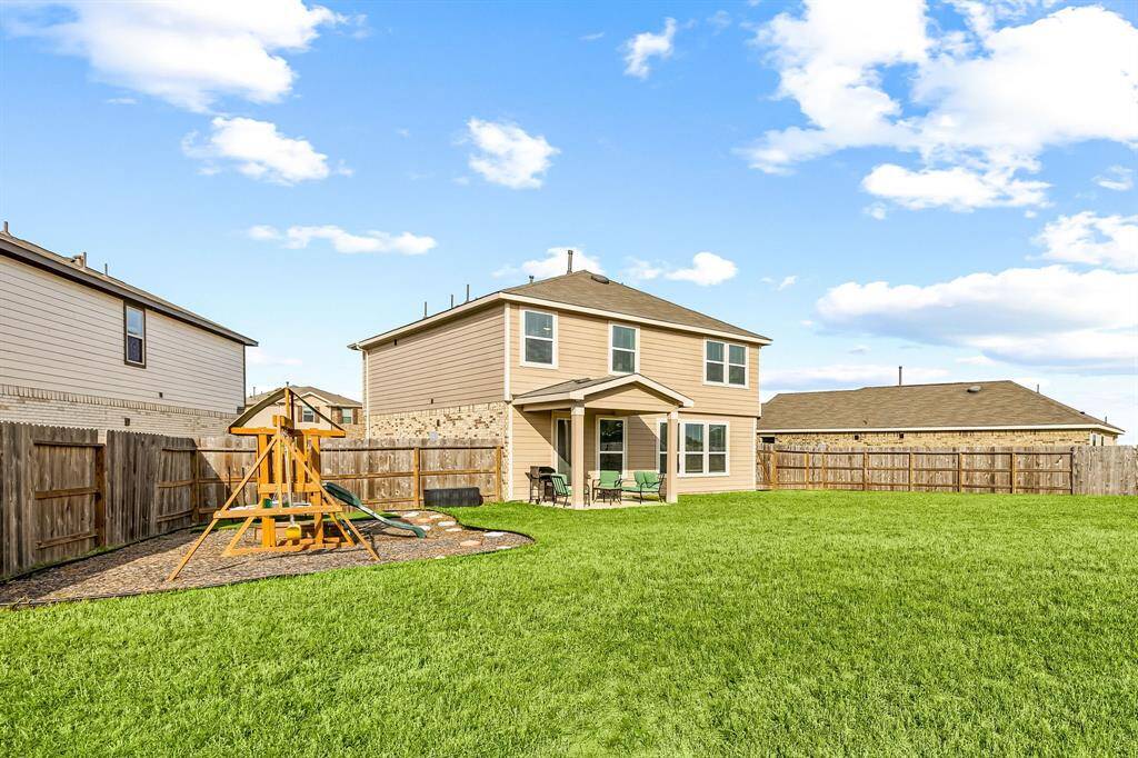 Come and see this spacious backyard with its beautiful covered patio. There is plenty of room for the kids to play and adults to relax! Perfect for your outdoor living space, patio furniture, bbq pit, and so much more. The possibilities are endless!