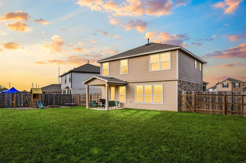 Sit back, relax and enjoy your gorgeous backyard under your large covered patio. Your covered patio overlooks your huge backyard with plenty of green space for the kids and your furry friends to enjoy.