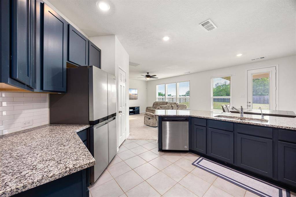 Any chef's dream, this stunning kitchen is perfect for everyday life as well as entertaining family and friends! Extra large kitchen bar is perfect for conversation or that much needed space to lay out your party spread for everyone to enjoy! Large windows provide lovely views of your backyard and plenty of natural lighting throughout the day.
