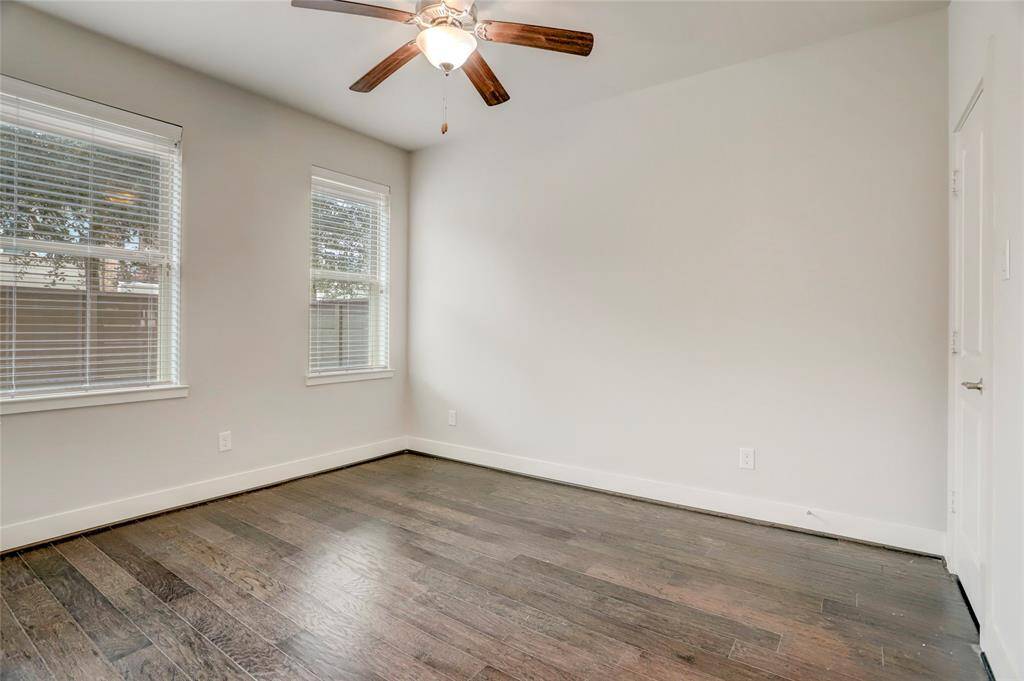 1st Floor Secondary Bedroom with en-suite bath, wood floors and walk-in closet.  This room is also flexible as a Home Office, Guest Suite, Home Gym, Playroom or other.