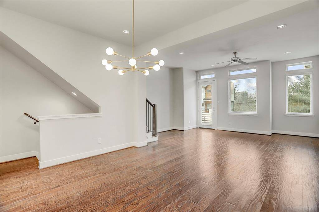 The Dining Room is spacious enough for a table of any shape and features a recent, on-trend light chandelier (2025), recessed LED lights and wood floors.