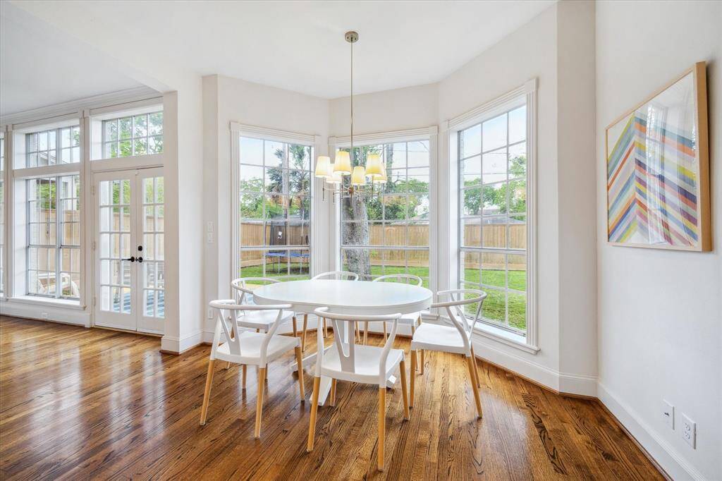 The breakfast area is thoughtfully positioned to offer a peaceful view of the backyard, providing a serene setting for casual dining.