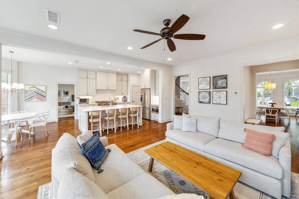 This room is thoughtfully crafted to create an open-concept layout, where the living, kitchen, and breakfast areas flow together as one expansive space.