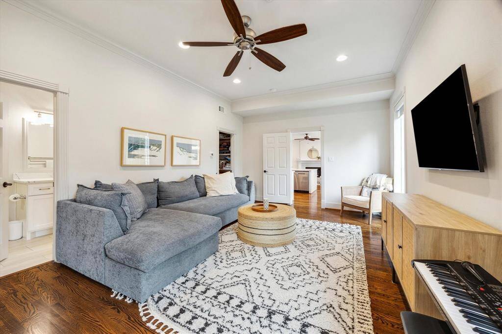 The downstairs bedroom, with its private en-suite bath, offers an elegant retreat for guests and is currently appointed as a sophisticated den but could be used as a game room!