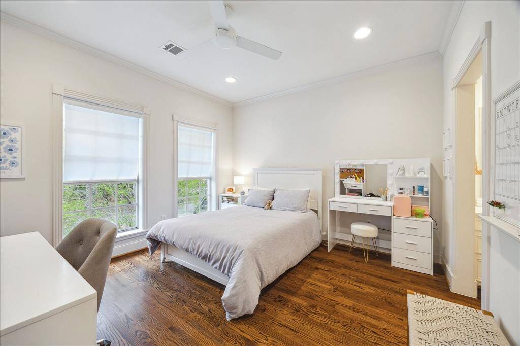 This front secondary bedroom is adorned with dual north-facing windows and offers convenient access to the Jack & Jill bathroom, located to the right of the room. Ceiling fan and recessed lights!