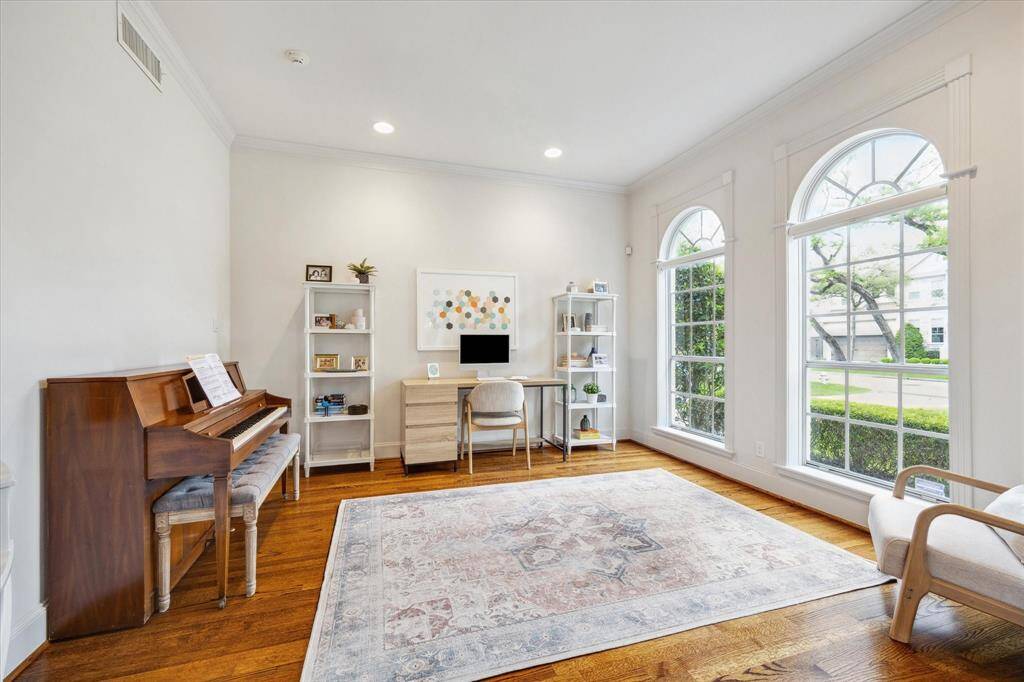 To the right of the entry hall is a large living room with north facing windows overlooking the front lawn.