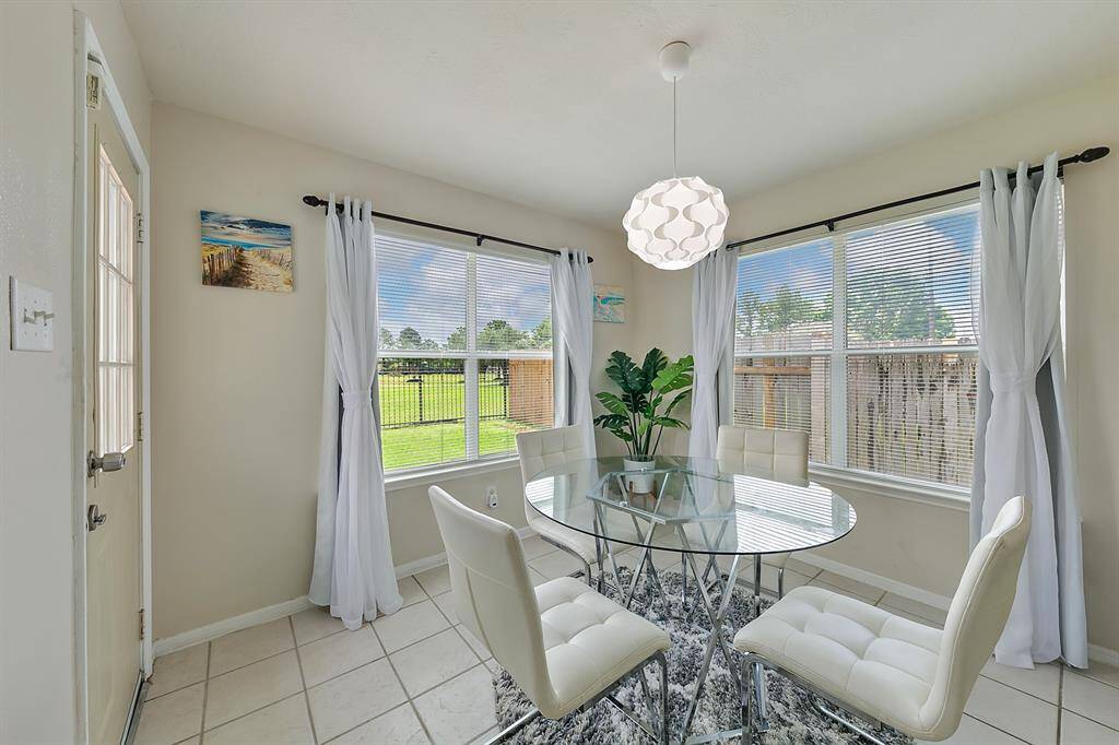 The cozy breakfast nook offers a peaceful spot to enjoy your morning coffee, with a beautiful view of the backyard. Its bright, inviting atmosphere makes it the perfect place to start your day.
