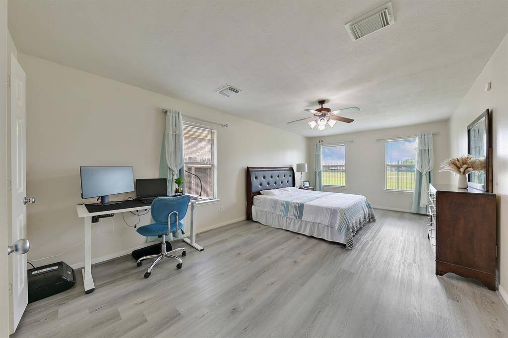 The spacious primary suite offers a tranquil retreat, with large windows that provide stunning views... Its generous layout creates a serene, comfortable space to unwind and enjoy the surrounding natural beauty.