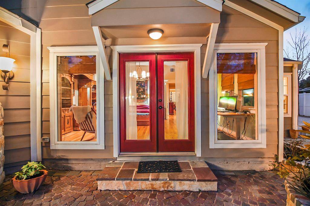 The third entry to the main house provides direct access to the very large (17x19) bedroom/study combo from the backyard. Small, covered patio covers the French door. Observe large energy efficient side windows.