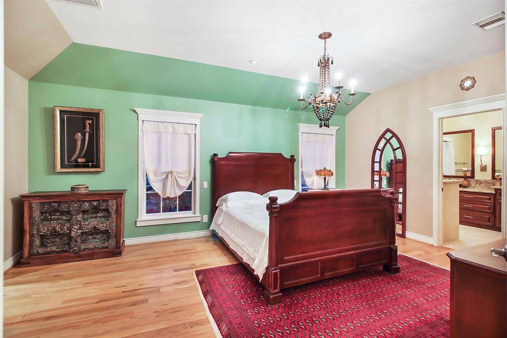 Spacious (13x18) master bedroom also has a raised ceiling. To the right is the en suite bathroom serving the master bedroom.