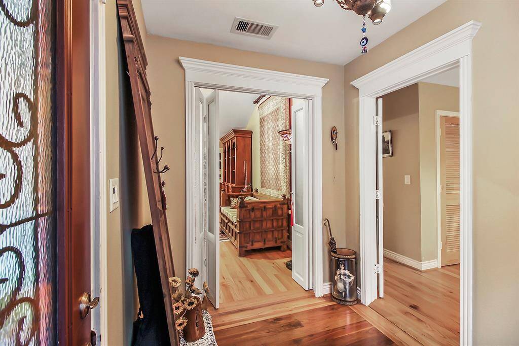 We circle back to the front of the house to show the foyer entrance built in 2008. This entry area gives access to the family area and to the eastern wing of the main home where the third bedroom and en suite bathroom are situated.