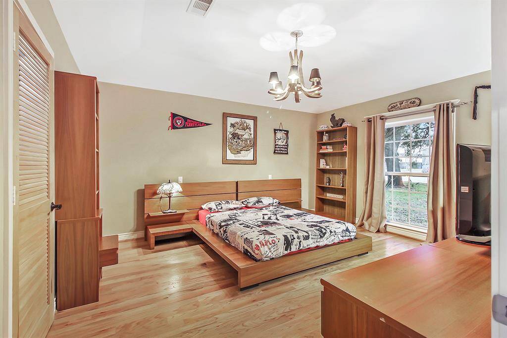 The third bedroom is 13x18.5 and sports two walk-in closets for ample storage space, hardwood flooring, raised ceilings, and large windows to ensure plenty of natural lights and good views of the front yard area.