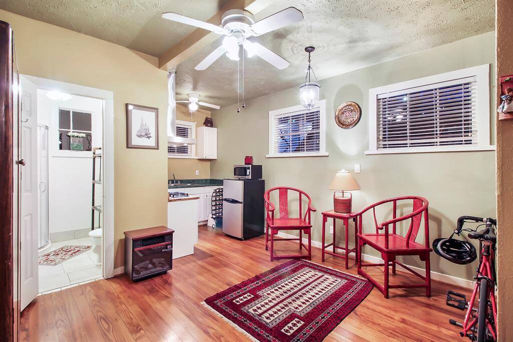 The northern end of the guest house hosts the complete kitchenette/breakfast area and a separate bathroom to the left. Several ceiling fans and a window AC unit provides plenty of fresh air year-round.