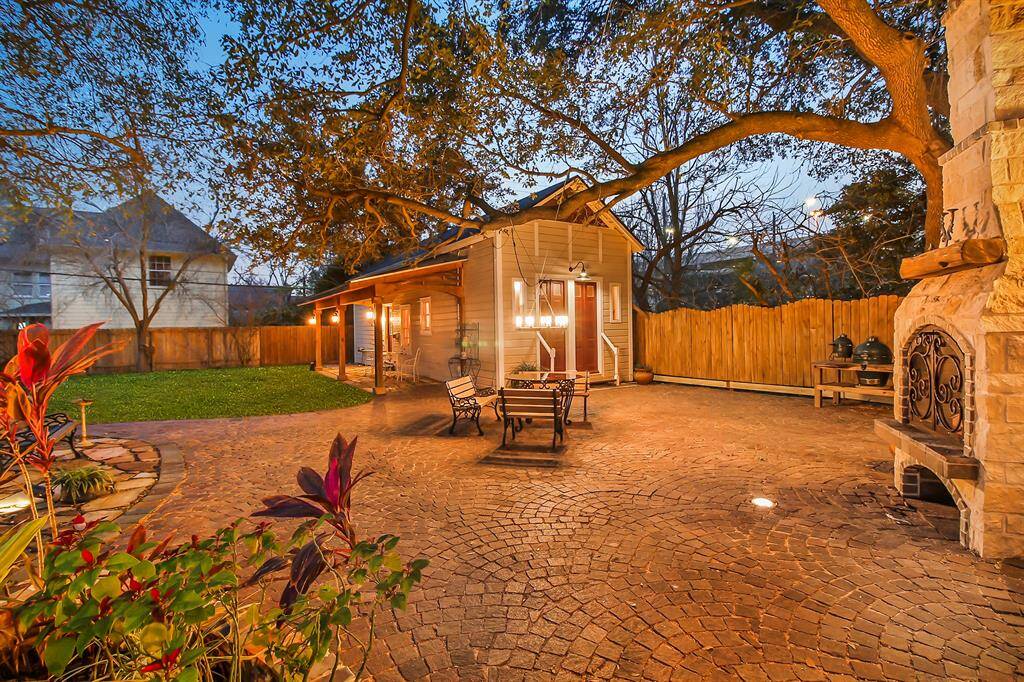 A fully renovated and well-maintained guest house at the end of the back patio is a historical Texas building. Guest house has a full size side porch to provide additional protection from the elements. Backyard lighting package extends to this area for evening enjoyment. Guest house received a new roof in 2019.