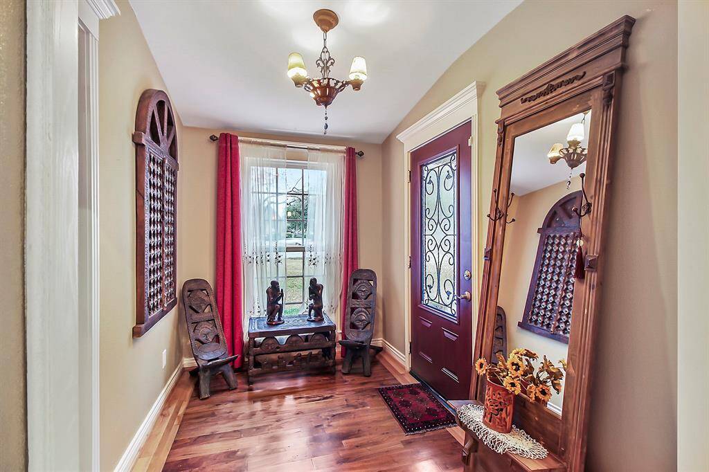 Foyer entry provides access to both the family area and to a private living quarter to the left. Window provides plenty of natural light and views of the outdoors.