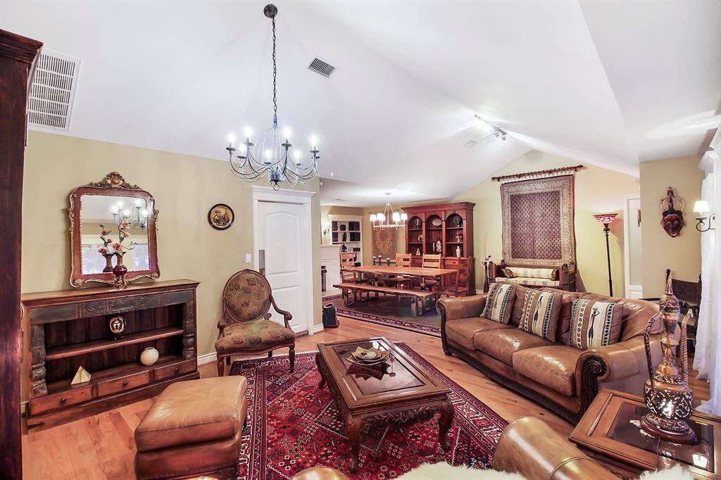 View of the dining area from the family room shows the flexibility and potential this section of the house can offer. Notice the real hardwood floor! This is not laminate floor!