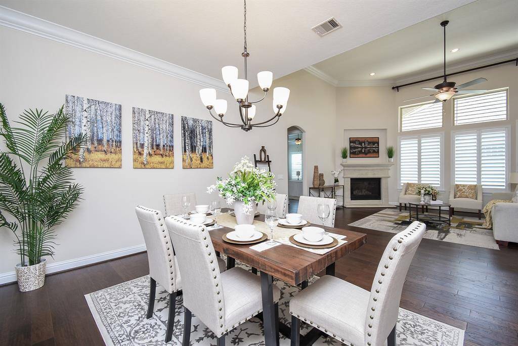 Gather around the table in this elegant dining space, where soft natural light and modern finishes set the scene for memorable meals and meaningful conversations.