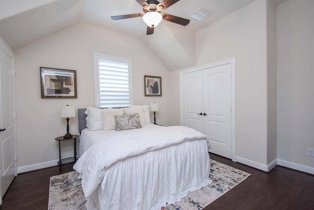 The first secondary bedroom offers great flexibility—use it as a guest room, a home office, or a peaceful retreat. With its vaulted ceiling and natural light, it’s a beautiful space to make your own.