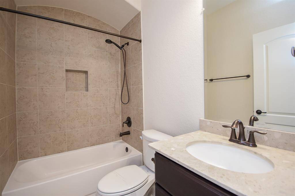 Upstairs includes its own full bathroom and a spacious closet—perfect for giving kids or guests a private space away from the main living area.
