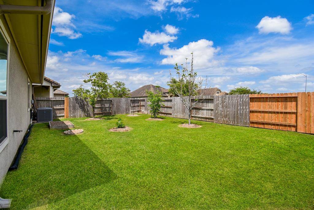 The backyard offers plenty of space to play, garden, or entertain—plus, no back neighbors for extra privacy and peace.