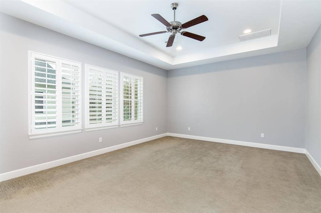 The spacious primary suite is located on the second floor.