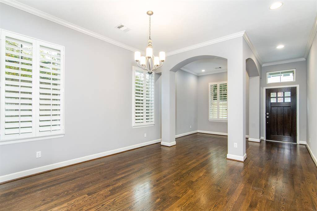 The first floor features an open floor plan and hardwood floors.