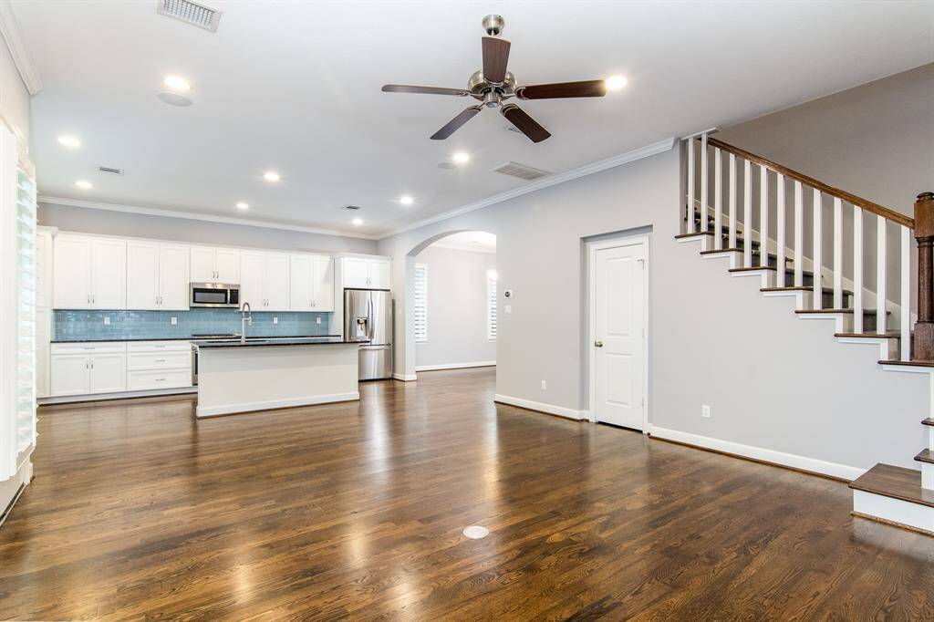 The kitchen is open to the large living room.
