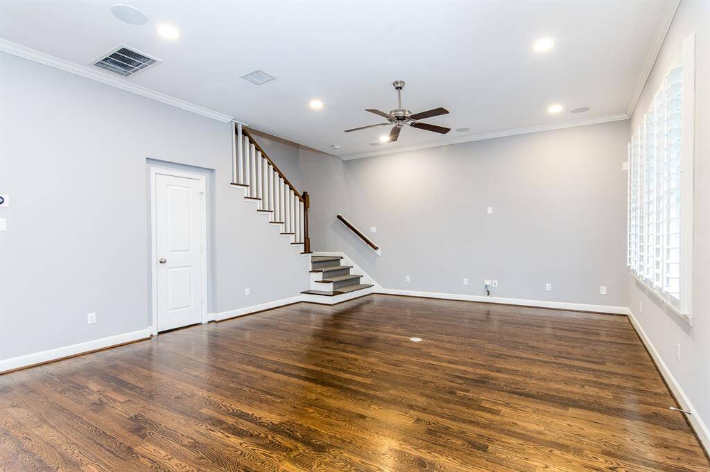 The living room is perfect for entertaining, and features a half bath.