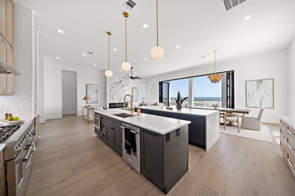 This kitchen is a chef's dream with its 48 inch Gas Stove and double islands.