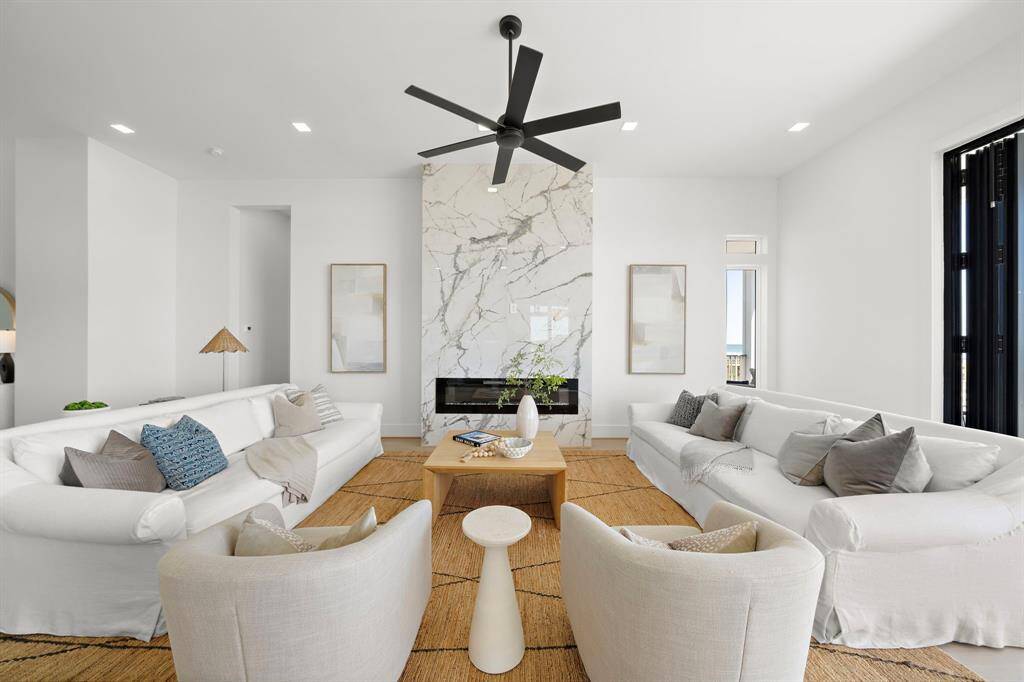 The Family Room boasts an impressive 33 ft wide span with a beautifully designed fireplace.