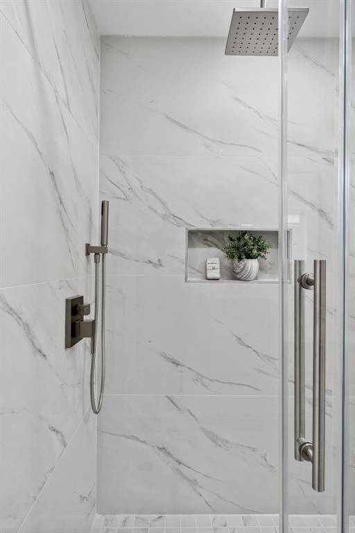 Rainfall showerhead adding a luxe touch to the primary bath.
